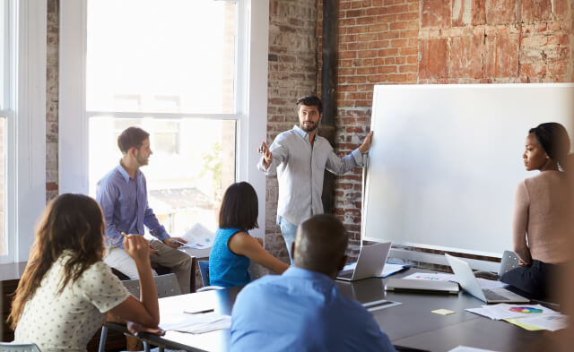 Glad recruiters shaking hands and offering the opportunity of building a new innovative carrier to a new creative employee